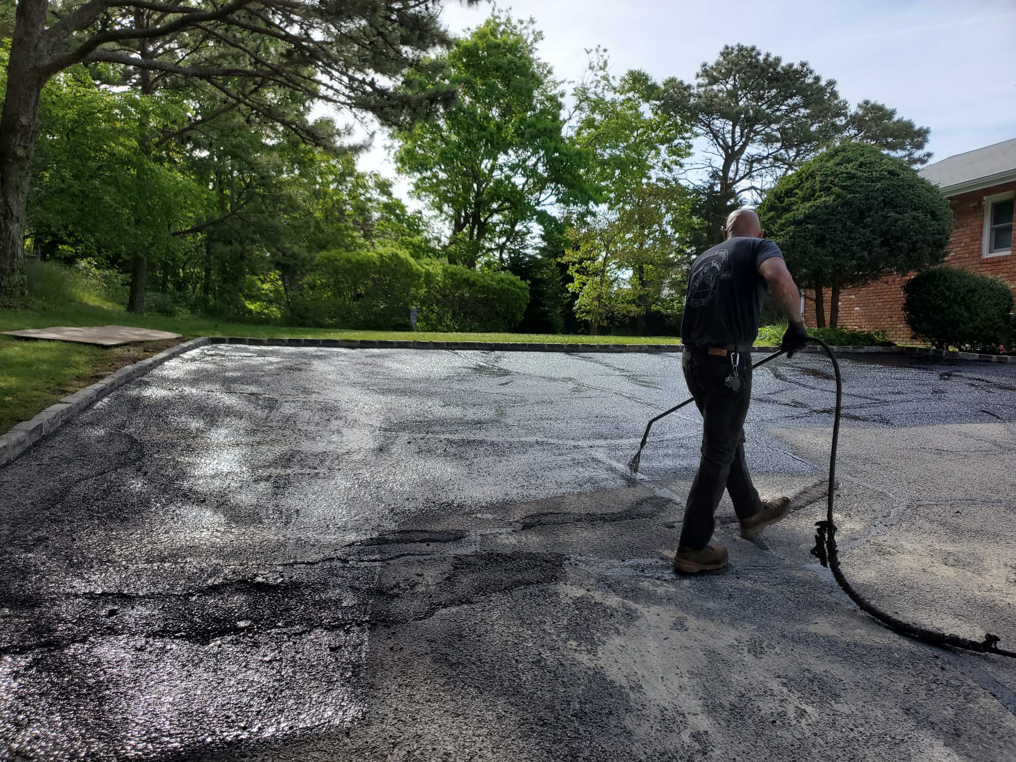 chip-and-seal-driveway-installation-all-seasons-paving-and-masonry